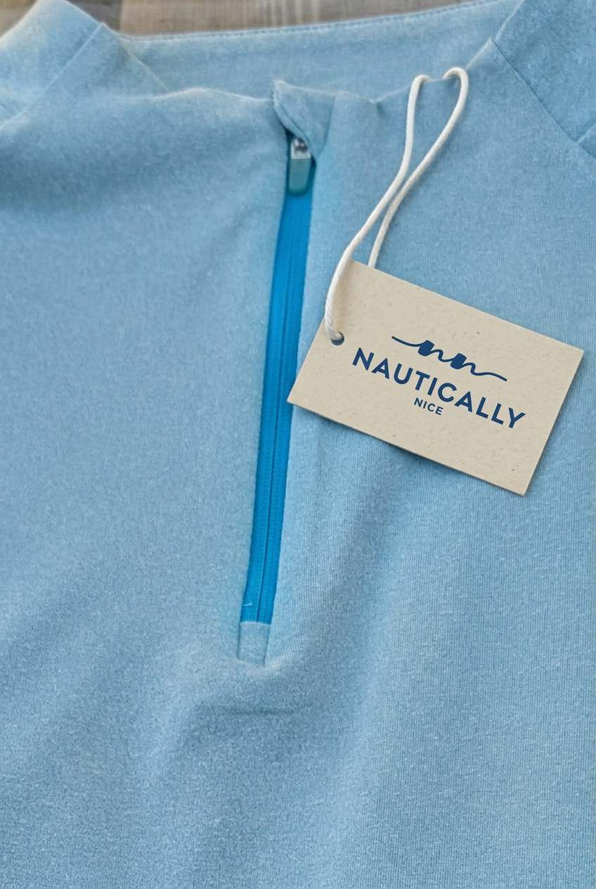 Light blue garment with your Nautically Nice hang tag and white cord